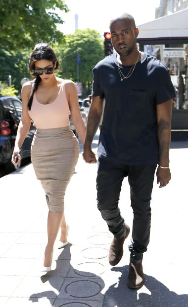Before their May 24, 2014 wedding, lovebirds Kim Kardashian and Kanye West pretty much took over Paris. Here, the couple -- who often enjoy matching one another -- took a pre-wedding stroll in the City of Light on May 19. This moment's pretty kute, but how does it stack up against these other PDA-filled moments?