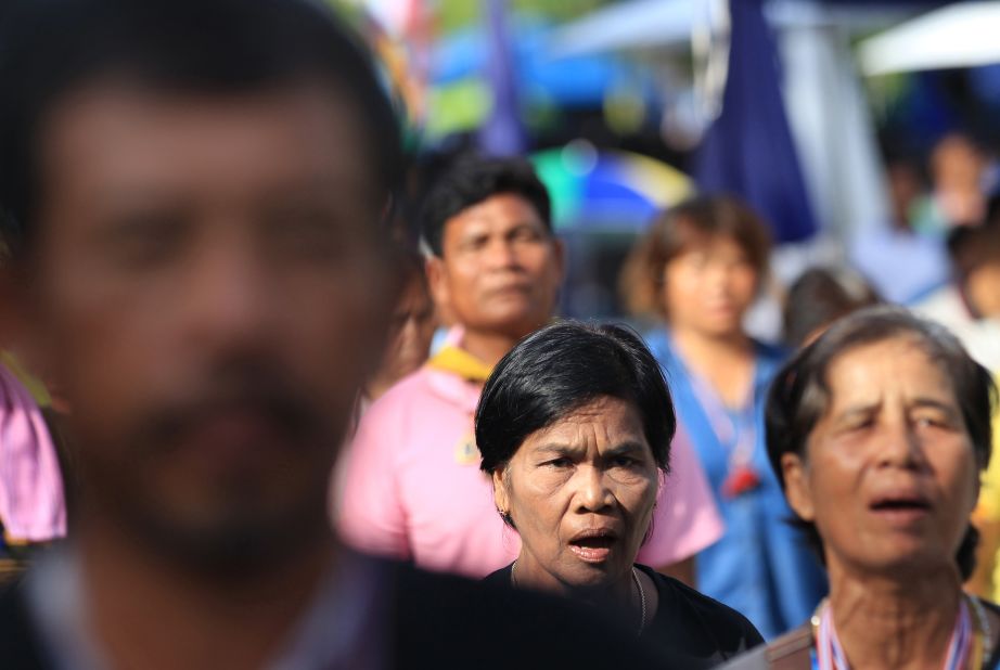 Anti-government protesters listen to their national anthem during a gathering in Bangkok on May 20.