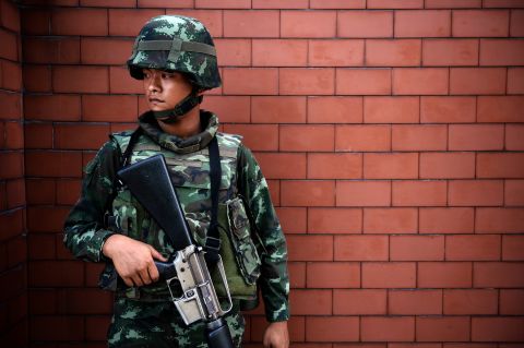 A soldier stands outside the Government Public Relations Department building on May 20.