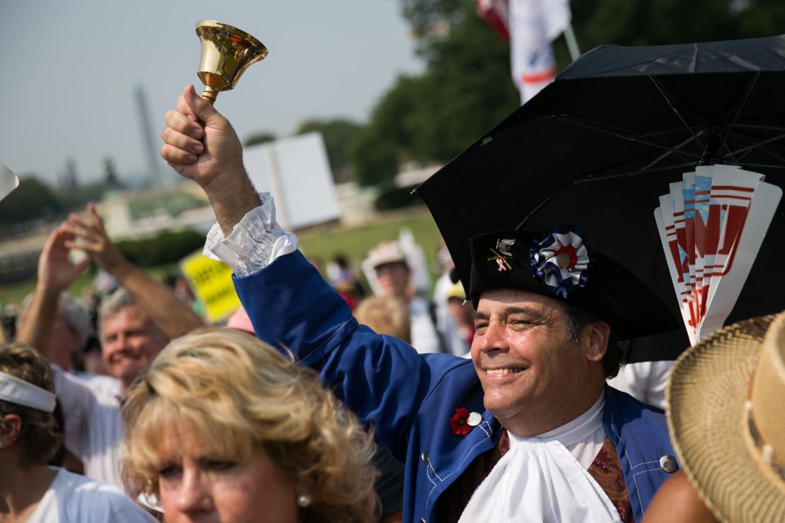 In this September 10, 2013, file photo, tea party activists cheer during a rally in Washington.