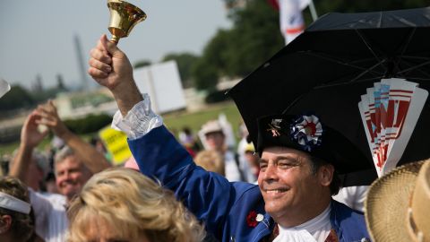 In this September 10, 2013, file photo, tea party activists cheer during a rally in Washington.