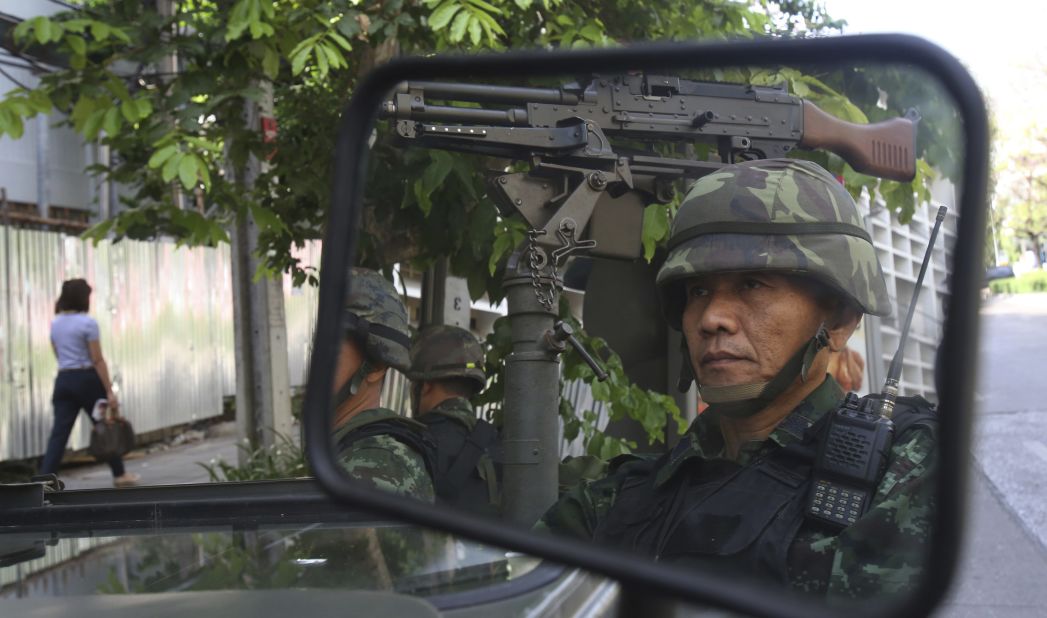Thai soldiers guard the Thai police headquarters in Bangkok on Tuesday, May 20.