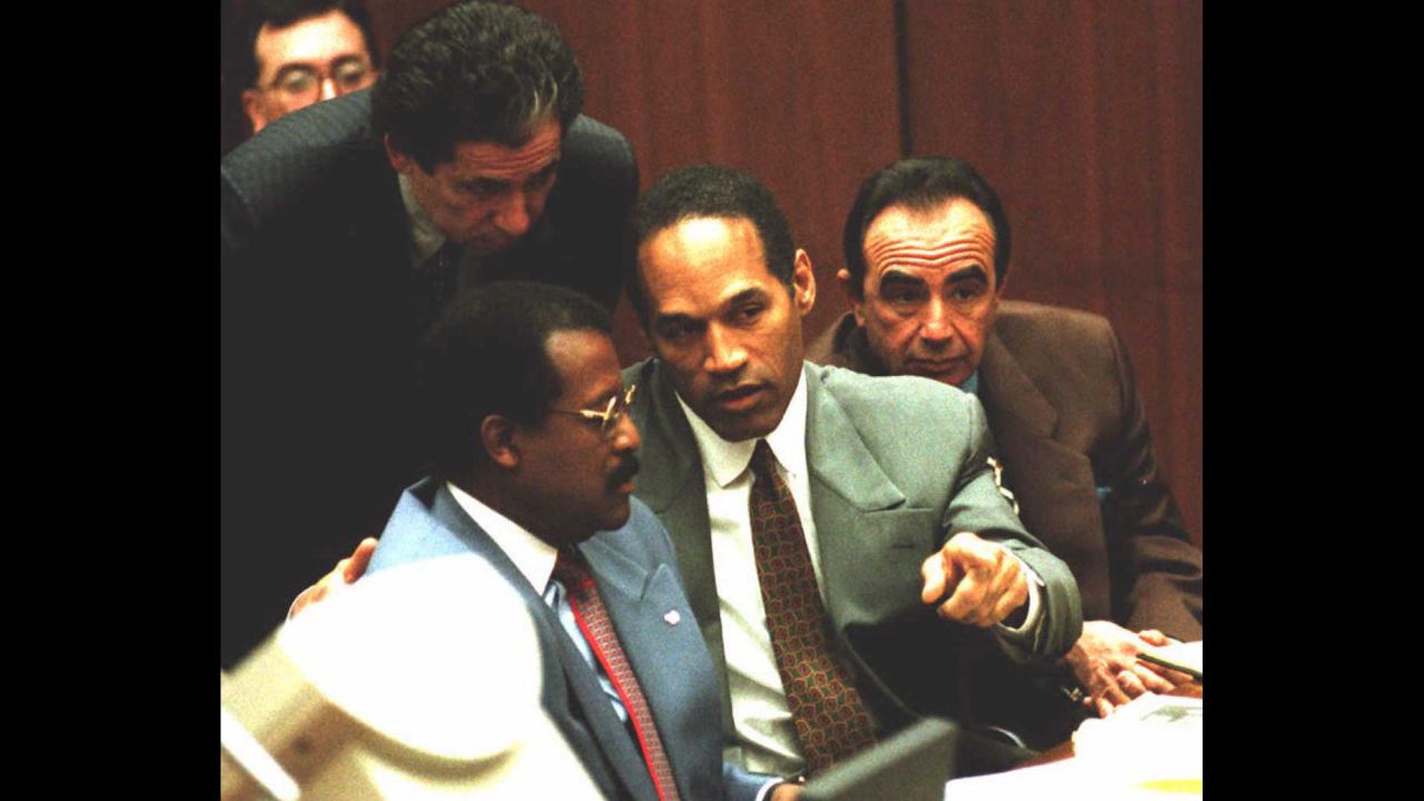 Probably one of the most famous cases ever involving a celebrity, O.J. Simpson, center, was arrested for the murders of his ex-wife, Nicole Brown Simpson, and her friend Ron Goldman in 1994. Here he confers with attorneys Johnnie Cochran, left, and Robert Shapiro during a hearing in 1995. Simpson's friend Robert Kardashian stands behind him. Simpson, a former pro football player, was acquitted in the criminal case.