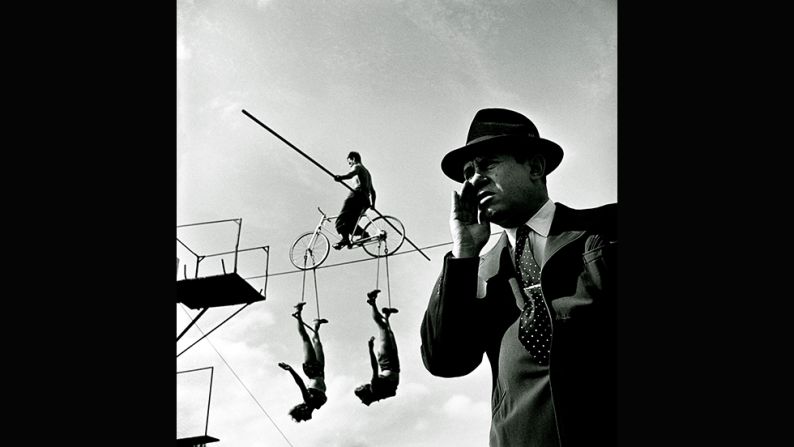 <em>How the Circus gets set -- Balancing act with trapeze artists, 1948</em><br /><br />In 1948 Kubrick spent several days photographing the personalities in and around  America's largest circus. The images convey the cinematic language that would later define his films.<br /><br />Ortner-Kreil says the photos also demonstrate his knowledge of avant-gard and Bauhaus photography, which he would have encountered on his many trips to New York's Museum of Modern Art as a child.<br /> <br />"If you look at the point where this bar is cutting the rope it's really in the middle," she says. "It appears to be a collage, not a photograph. All the different details are arranged very carefully, and he chooses the perspective of the director of the circus who is shouting at the artists and acrobats. He takes the camera down to underline the authority of the director." 