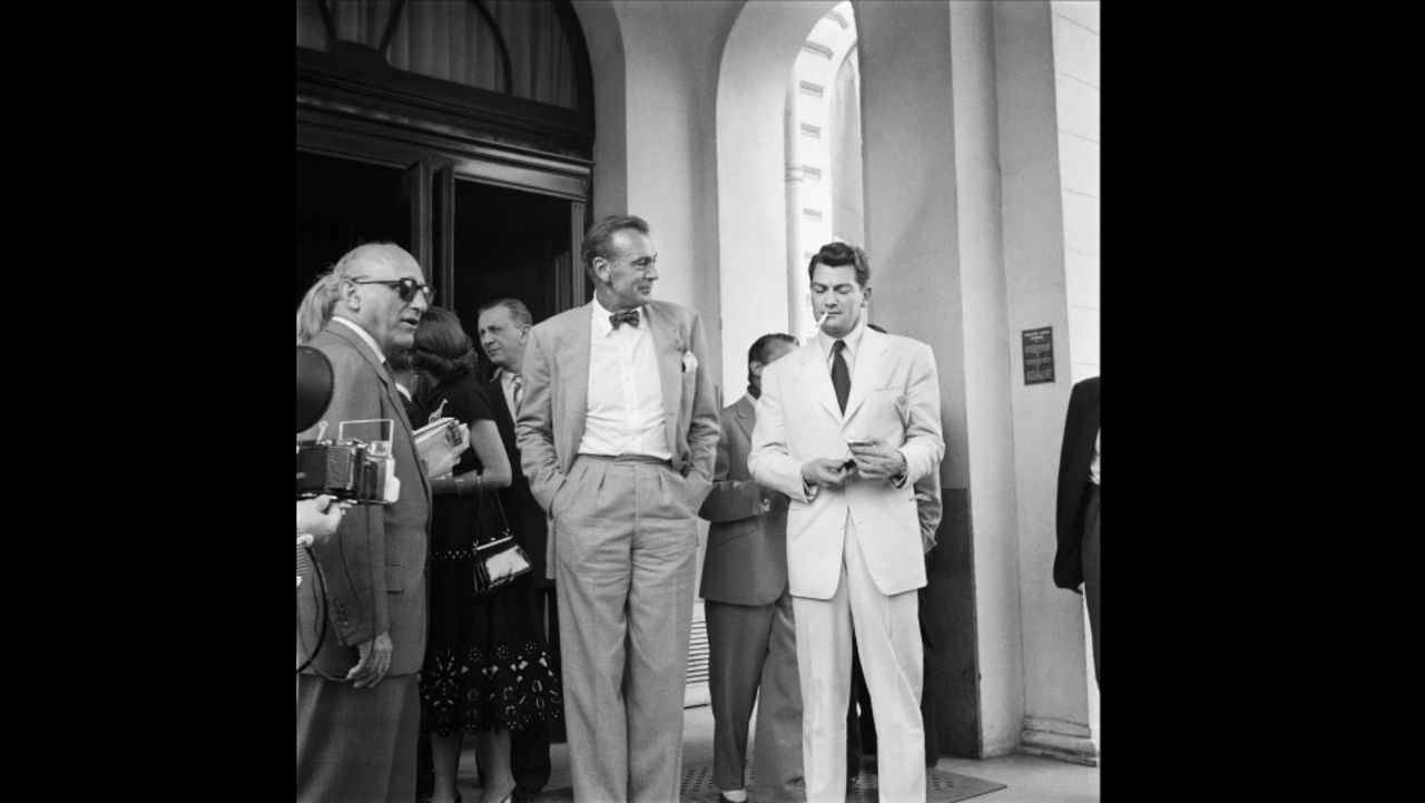 Cigarettes and bow ties were the height of fashion in the 50s. U.S. actor Gary Cooper (bow tie) talks to French actor Jean Marais (cigarette) during the Cannes Film Festival in 1953. 