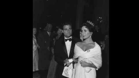 Elizabeth Taylor swaddles herself in white for the 1957 festival, accessorizing with a modest crown and her third husband, producer Mike Todd. 