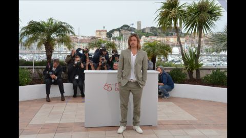 It is not immediately clear why this long blonde hair and white lace up look works, but it really, really does. Brad Pitt works the photo call for "Killing Me Softly" in Cannes, 2012.