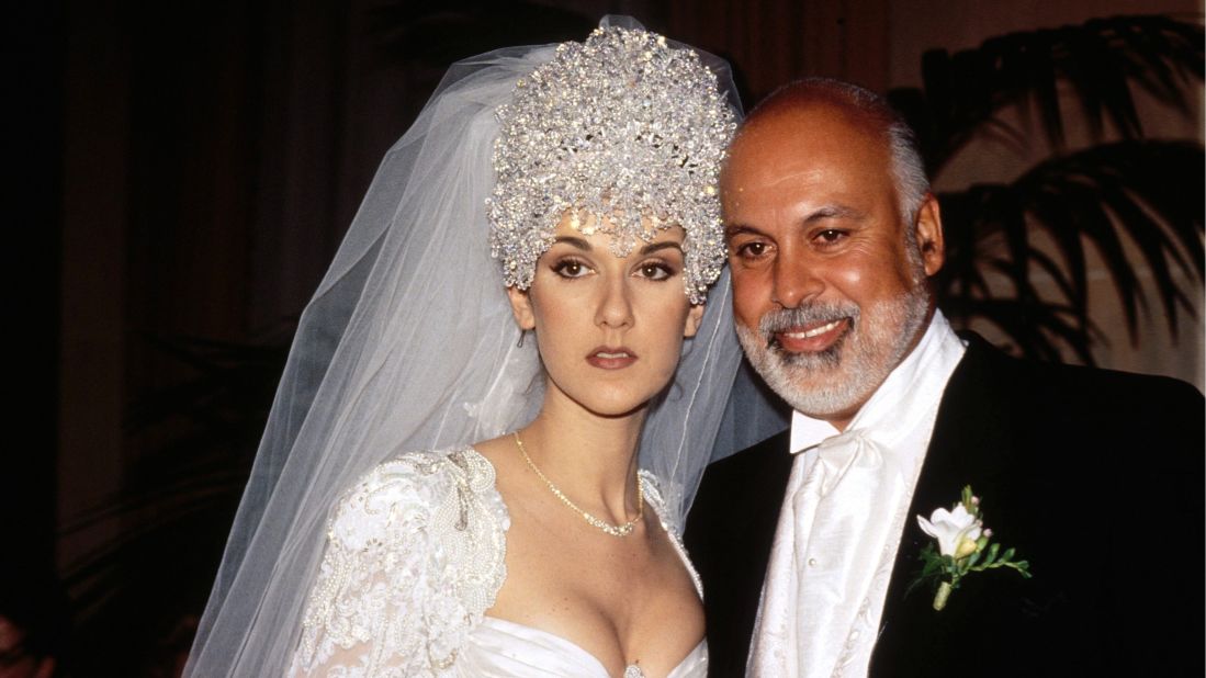 Celine Dion married manager René Angélil in 1994 in Montreal. Her dress <a href="http://xfinity.comcast.net/slideshow/music-musicweddings/" target="_blank" target="_blank">reportedly had a 20-foot train, and she wore a 7-pound tiara made up of thousands of Austrian crystals. </a>