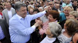Ukrainian independent presidential candidate Petro Poroshenko is greeted by supporters during an election campaign rally on May 20, 2014, in Ukrainian city of Uman, Cherksy region.