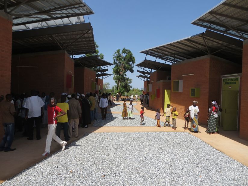 Opened in June 2014, the Surgical Clinic and Health Center in Léo serves a population of over 50,000 people. For the construction, characteristic mud bricks were used with a 'flying roof'. The high thermal mass of the bricks "allow them to absorb cool night air and releasing it during the day."