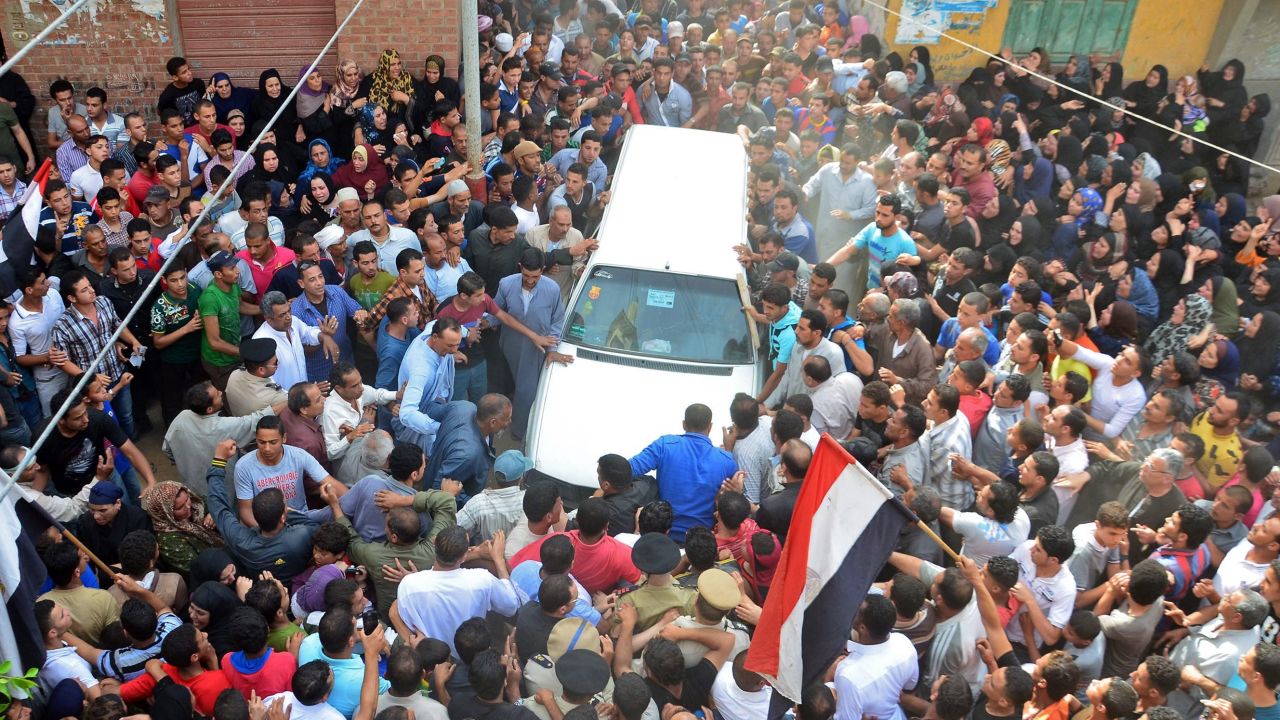 Mourners gather at a funeral after deadly clashes in Cairo.