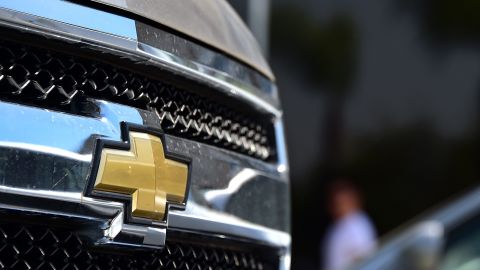A man walks past cars parked outside a shopping mall in Alhambra, California, including a Chevrolet Silverado pickup truck from General Motors on left on May 16, 2014. The US auto safety regulator Friday imposed a record $35 million fine on General Motors for its failure to promptly recall cars with ignition faults linked to at least 13 deaths. General Motors has issued yet another recall on its 2014 Chevrolet Silverado and GMC Sierra pickups, this time for a steering issue that could cause a sudden crash. AFP PHOTO/Frederic J. BROWN (Photo credit should read FREDERIC J. BROWN/AFP/Getty Images)