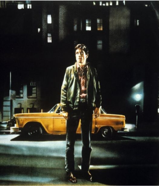 A 23-year-old Robert De Niro as Travis Bickle. The film follows ex-marine Travis as he becomes a taxi driver to cope with chronic insomnia, driving passengers every night around the boroughs of New York City.