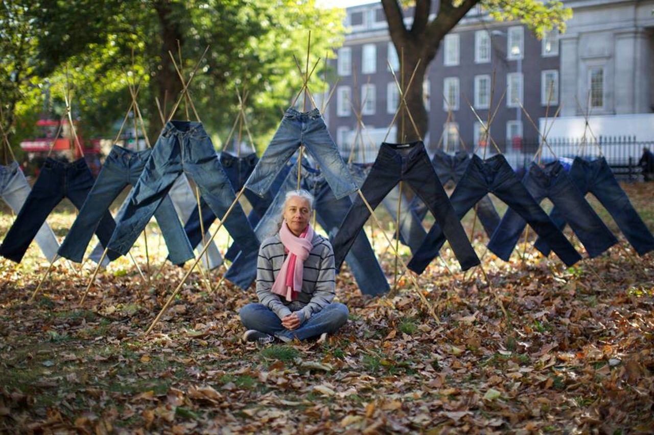 Designer Helen Storey among a "Field of Jeans" treated with anti-pollution detergent.