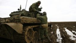 Russian soldiers load rounds into their tank during military exercises in the southern Russia's Volgograd region, on April 2, 2014.