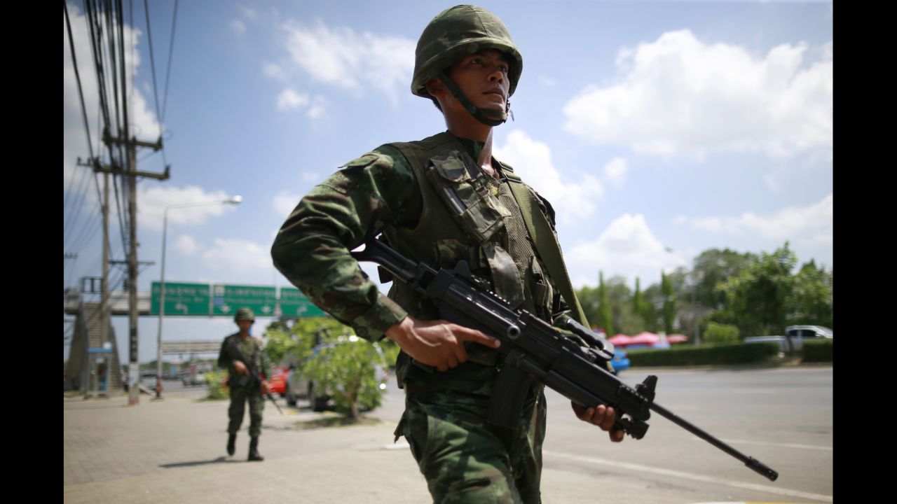 Thai soldiers patrol near a rally site for pro-government demonstrators on the outskirts of Bangkok on Thursday, May 22.