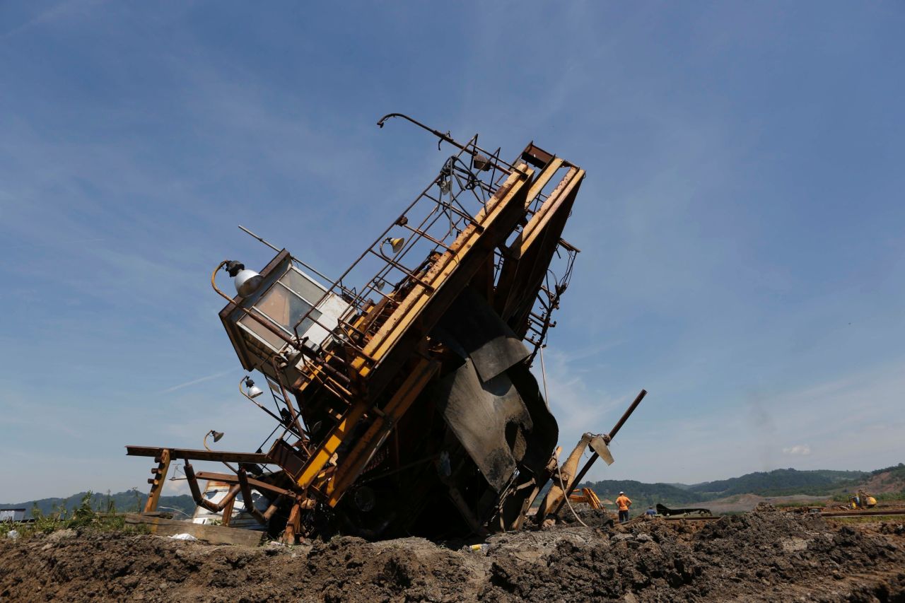 Bosnian workers inspect the damage on heavy machinery after devastating flooding at a coal mine in the village of Sikulje on Thursday, May 22. Heavy rainfall in Serbia and neighboring Bosnia-Herzegovina has resulted in the worst flooding since records began 120 years ago, meteorologists say.