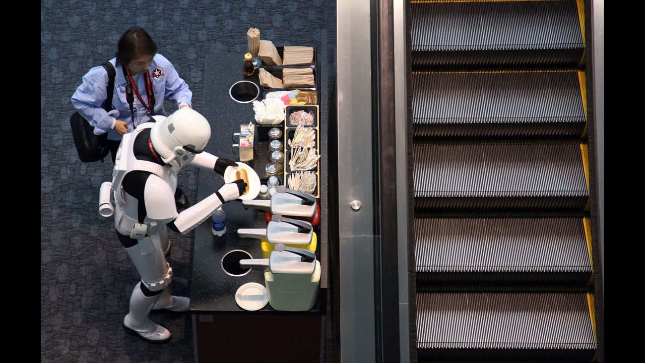 A man dressed as a "Star Wars" stormtrooper prepares a hot dog during the 2011 WonderCon in San Francisco.