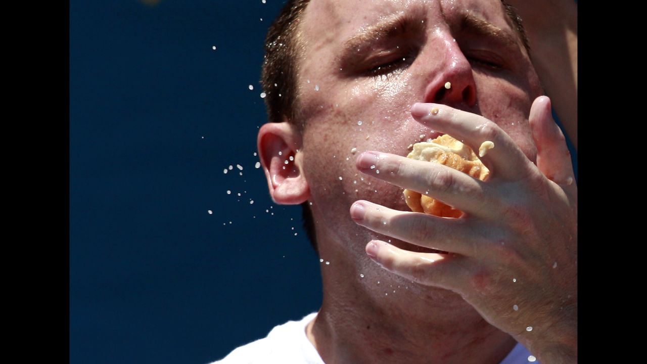 Competitive eater Joey Chestnut competes in the 2012 Nathan's July Fourth hot dog eating contest at New York's Coney Island. Chestnut ate a record-tying 68 hot dogs to win.