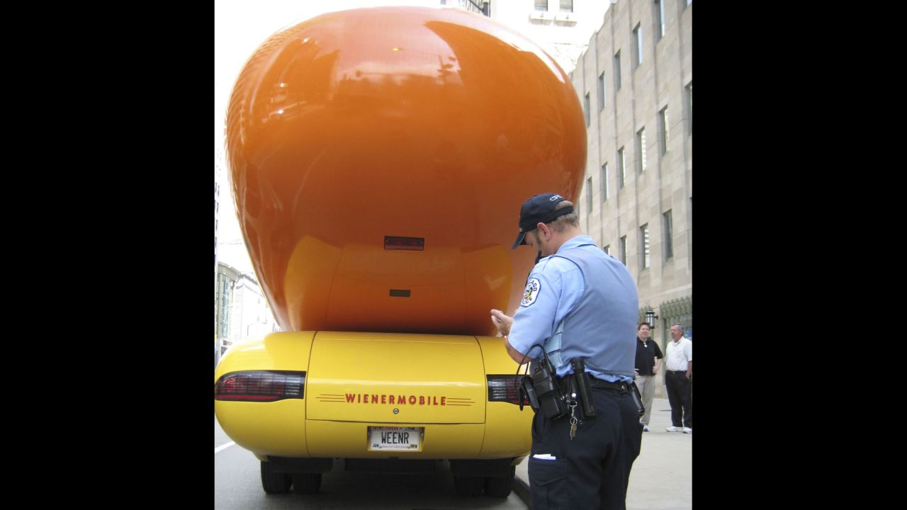 A Chicago police officer writes a traffic ticket for the Oscar Mayer Wienermobile in 2007.