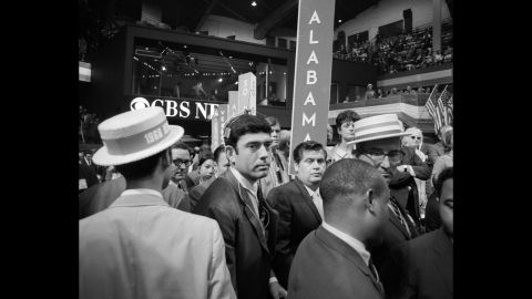 The 1968 Democratic Convention, held in Chicago, was a scene of chaos both inside and outside the convention hall. At one point, CBS correspondent Dan Rather, center, was treated roughly by security, prompting anchor Cronkite to comment, "I think we've got a bunch of thugs here, Dan." Outside, protesters chanted, "The whole world is watching." 