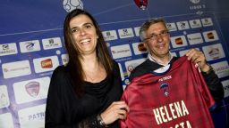 French Helena Costa (L) holds her new jersey next to Clermont Foot's football team president Claude Michy (R) during her official presentation as Clermont Foot's football team new coach, on May 22, 2014 in Clermont-Ferrand. Costa is the first woman to coach a professional football team in France. AFP PHOTO THIERRY ZOCCOLAN (Photo credit should read THIERRY ZOCCOLAN/AFP/Getty Images)