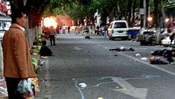 Victims of a bombing lie on a street near the site where attackers ploughed two vehicles into a market and threw explosives, killing at least 31 people, in Urumqi in northwest China's Xinjiang region on May 22, 2014. More than 90 people were also wounded when two off-road vehicles drove into a crowd in Urumqi, with one of them exploding, the regional government's Tianshan web portal said, in what authorities called the latest "severe terrorist incident" to hit the Muslim Uighur homeland. CHINA OUT AFP PHOTO/STRSTR/AFP/Getty Images