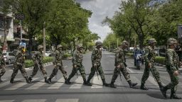 BANGKOK, THAILAND - MAY 23:  Thai soldiers patrol near government  buildings on May 23, 2014 in Bangkok, Thailand. The Army chief announced in an address to the nation that the armed forces were seizing power in a non-violent coup. Thailand has seen months of political unrest and violence which has claimed at least 28 lives. (Photo by Paula Bronstein/Getty Images)
