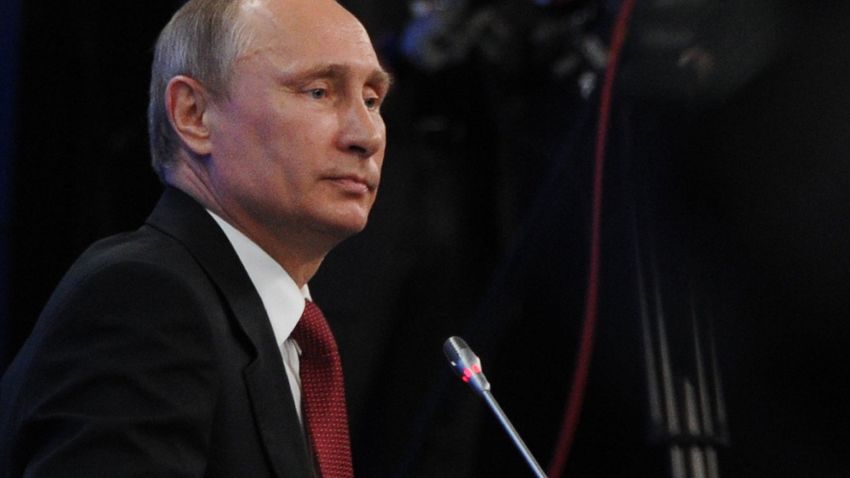 Russia's President Vladimir Putin attends an economic forum in Saint Petersburg, on May 23, 2014. 