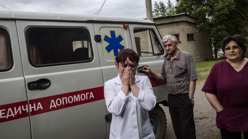 A nurse cries as she reacts after seeing the bodies of killed Ukrainian army soldiers in Volnovakha, on May 22, 2014, after an ambush at a check point between Blohoddatne and Horlivka, 50km south of Donetsk. Pro-Russian rebels firing mortar shells and grenades killed 14 Ukrainian soldiers today, the blackest day yet for the military and a dramatic ratcheting up of tensions just three days before a crunch election. The attacks in the eastern industrial belt near the Russian border underscored the difficulties of the embattled Kiev government in resolving a crisis that is threatening to tear the country apart. AFP PHOTO / FABIO BUCCIARELLI (Photo credit should read FABIO BUCCIARELLI/AFP/Getty Images)