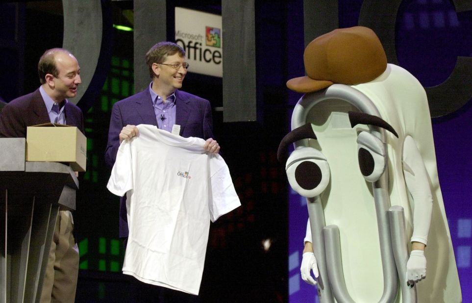 Microsoft CEO Bill Gates presents a T-shirt as a retirement gift to "Clippy" -- or someone dressed as the virtual Microsoft Office assistant -- a cartoon paper clip that once popped up on screens to assist and annoy users of the workplace software. Clippy was widely mocked before Microsoft retired the character in 2001.