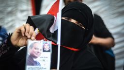 Caption:A veiled supporter of Egyptian ex-army chief and leading presidential candidate Abdel Fattah al-Sisi hold up his image during an organised supporters' rally aboard a boat moored on the River Nile during a supporters gathering in the Egyptian capital Cairo, on May 21, 2014, a week before the nation goes to the poles. Sisi is so sure of victory in the May 26-27 election that he has not addressed any public rallies in person or even revealed his election program. AFP PHOTO / MOHAMED EL-SHAHED (Photo credit should read MOHAMED EL-SHAHED/AFP/Getty Images)