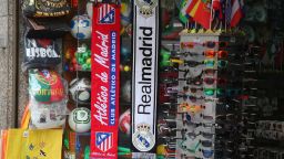 Real Madrid and Atletico de Madrid scarves are seen hanging outside a shop ahead of the UEFA Champions League Final on May 23, 2014 in Lisbon, Portugal