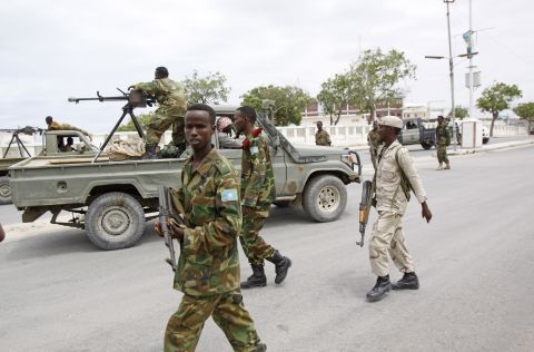 Somali government soldiers patrol the area during the attack.