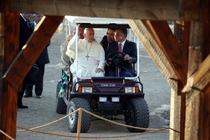 Pope Francis rides in a golf cart with King Abdullah II of Jordan on May 24 as they visit Bethany, on the eastern bank of the Jordan River.