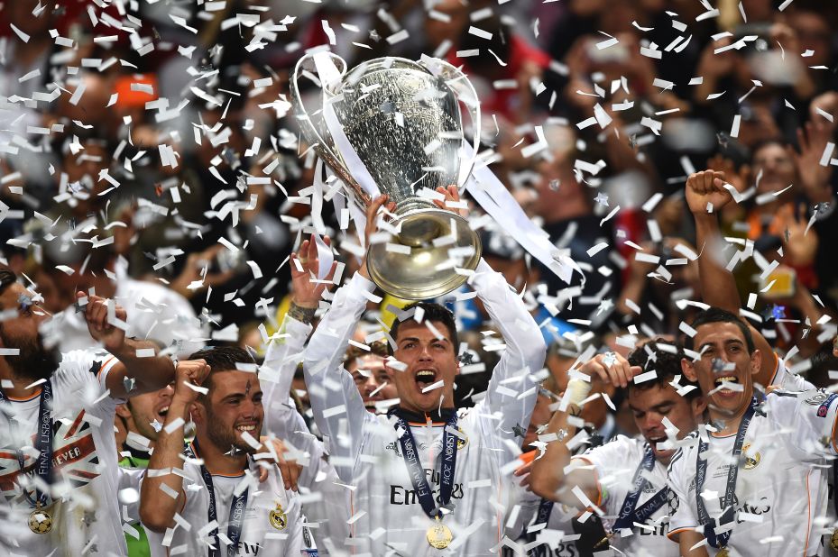 Cristiano Ronaldo of Real Madrid lifts the Champions League trophy after the team's  4-1 victory over Atletico on May 24 in Lisbon, Portugal. 