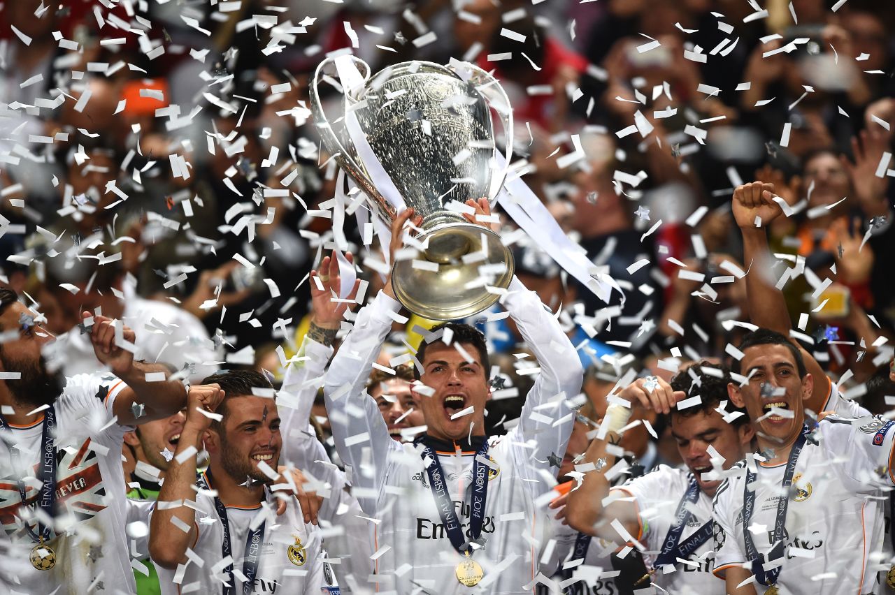 Cristiano Ronaldo of Real Madrid lifts the Champions League trophy after the team's  4-1 victory over Atletico on May 24 in Lisbon, Portugal. 