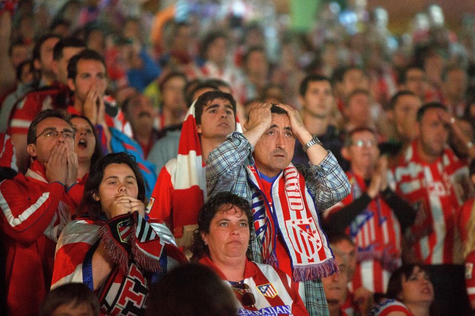  Atletico fans react during the match. 
