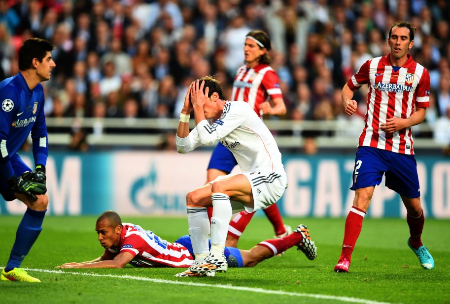 Bale holds his head in his hands in disbelief after wasting Real's best chance of the first half against Atletico.