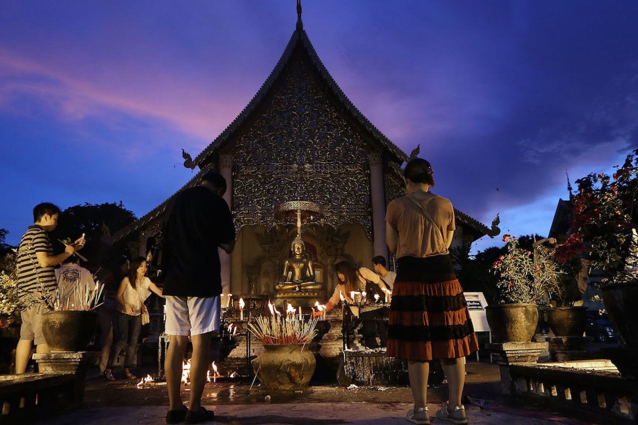 Thai Buddhists make offerings at Chiang Mai's Wat Chedi Luang, located in the historic center of the city. 
