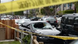 Caption:A crashed car, allegedly driven by a gunman, sits partly on the sidewalk on May 24, 2014 in Isla Vista, California, a beach community next to the University of California Santa Barbara. Seven people, including the gunman, were killed and seven others wounded in the May 23 mass shooting, Santa Barbara County Sheriff Bill Brown said Saturday. Brown said at a pre-dawn press conference that the shooting in the town of Isla Vista 'appears to be a mass murder situation.' Driving a black BMW, the suspect opened fire on pedestrians from his vehicle at several locations in the town. Police received their first emergency calls about the shooting around 9:30 pm Friday (0430 GMT Saturday). AFP PHOTO/ROBYN BECK (Photo credit should read ROBYN BECK/AFP/Getty Images)