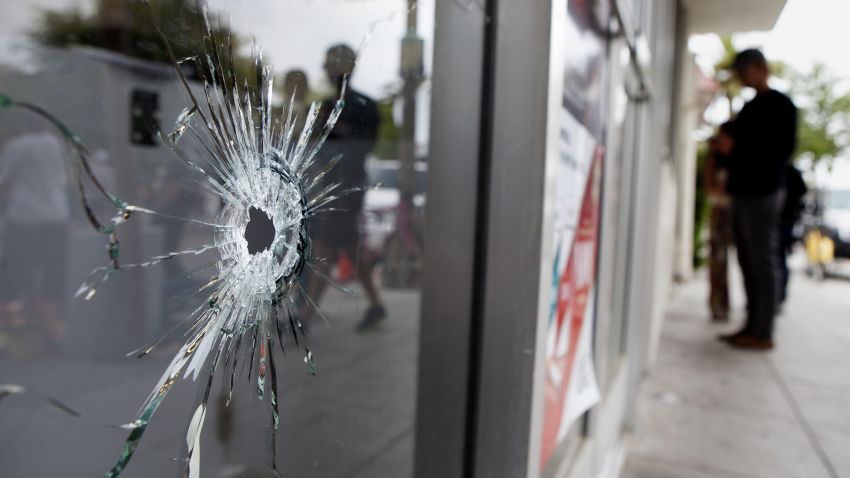 Caption:ISLA VISTA , CA - MAY 24: Bullet holes are seen in the window of the IV Deli Mart, one of several crime scenes on May 24, 2014 in Isla Vista, California. A mentally disturbed 22-year-old man sprayed bullets from his car in the Southern California college town of Isla Vista, killing seven people. (Photo by Spencer Weiner/Getty Images)
