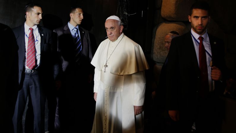 Surrounded by Israeli security guards, Francis leaves the Hall of Remembrance at the Yad Vashem Holocaust Memorial and Museum in Jerusalem on May 26.