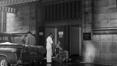 A VA patient wheeled into an outpatient clinic in Boston in 1961. The American Medical Association said vets should be treated in private hospitals