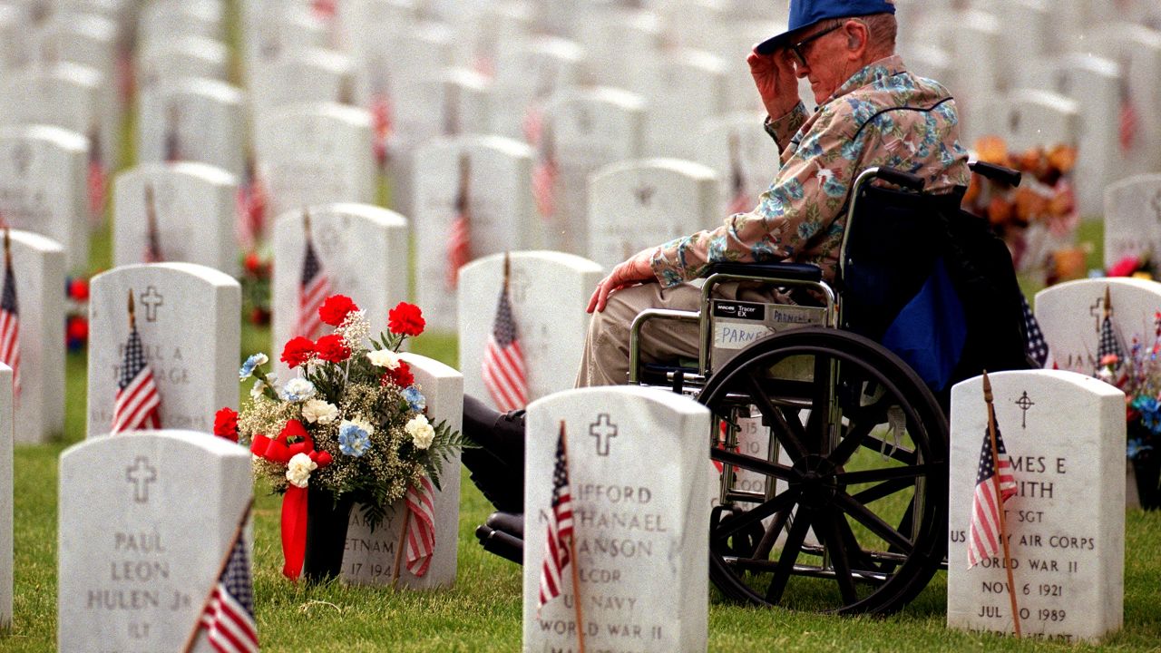 Air Force veteran Joseph Parnell Sr., visits the grave of his son, Joseph Parnell Jr., at Fort Logan National Cemetery.