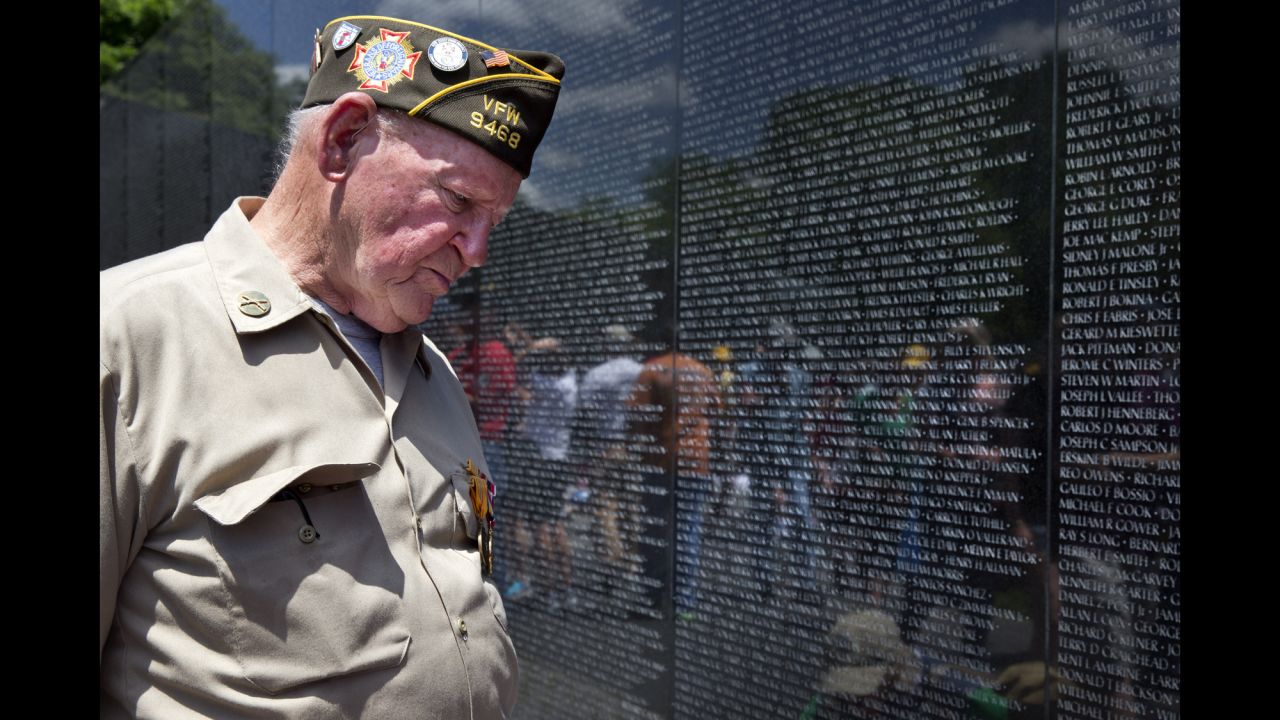 World War II veteran Jimmy Bishop Jr. looks at names on the Vietnam Veterans Memorial in Washington on May 25, 2014.