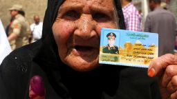 Caption:An Egyptian woman shows a fake Identity card of presidential candidate and former army chief, Abdel Fatah al-Sissi, after voting at a polling station on the outskirts of the village of Kirdassa, a hot bed for Islamists southeast of Cairo on May 26, 2014. Egyptians voted for a new president in an election expected to sweep to power the ex-army chief, Abdel Fattah al-Sisi, who overthrew the country's first democratically-elected leader and crushed his Islamist movement. AFP PHOTO/ MARWAN NAAMANI (Photo credit should read MARWAN NAAMANI/AFP/Getty Images)
