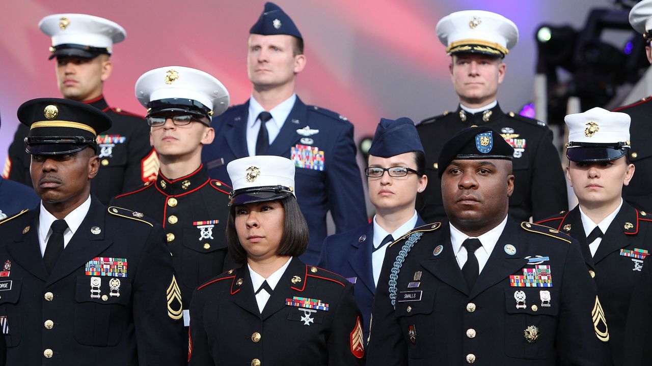 Military personnel stand at attention May 25, 2014, during the National Memorial Day Concert at the Capitol in Washington.