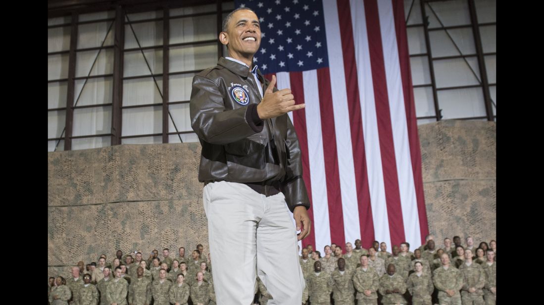Obama does a Hawaiian "shaka" as he greets U.S. troops during a surprise visit to Afghanistan on May 25, 2014.