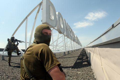 Pro-Russian militants take position on the roof of Donetsk International Airport on Monday, May 26.